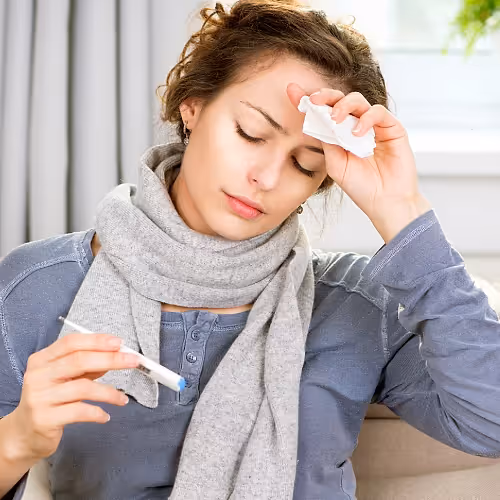 A patient receives IV therapy to help manage chronic Lyme disease symptoms in a comfortable wellness setting.