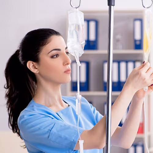 A patient receives IV therapy to support recovery after viral infections, with a focus on restoring energy and immune balance.