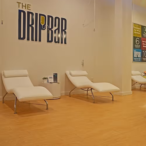 Private therapy room with comfortable seating and calming decor for IV treatments.