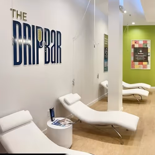 Cozy, bright wellness lounge with soft lighting and comfortable seating at St. Johns
