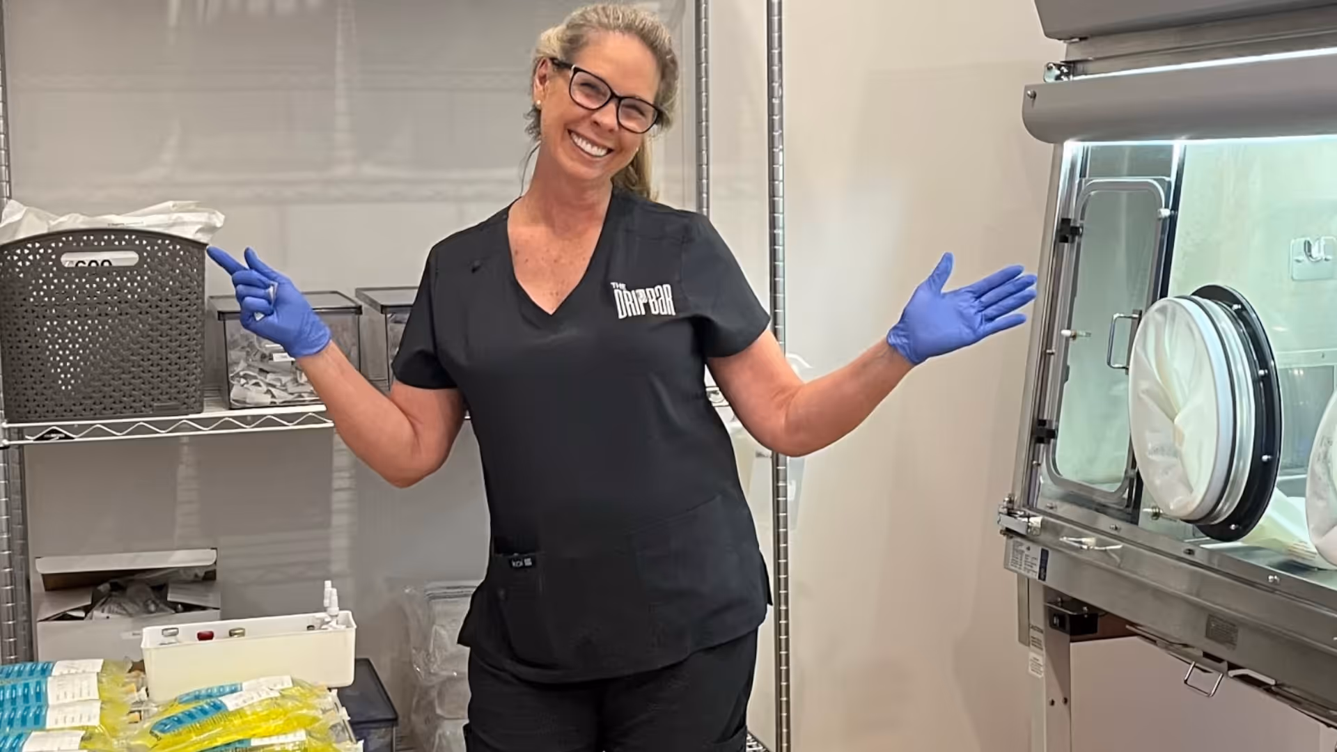Friendly staff member greeting a client at the front desk with a genuine smile