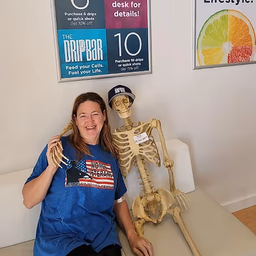 Clients relaxing in a wellness center lounge during nutrient therapy.